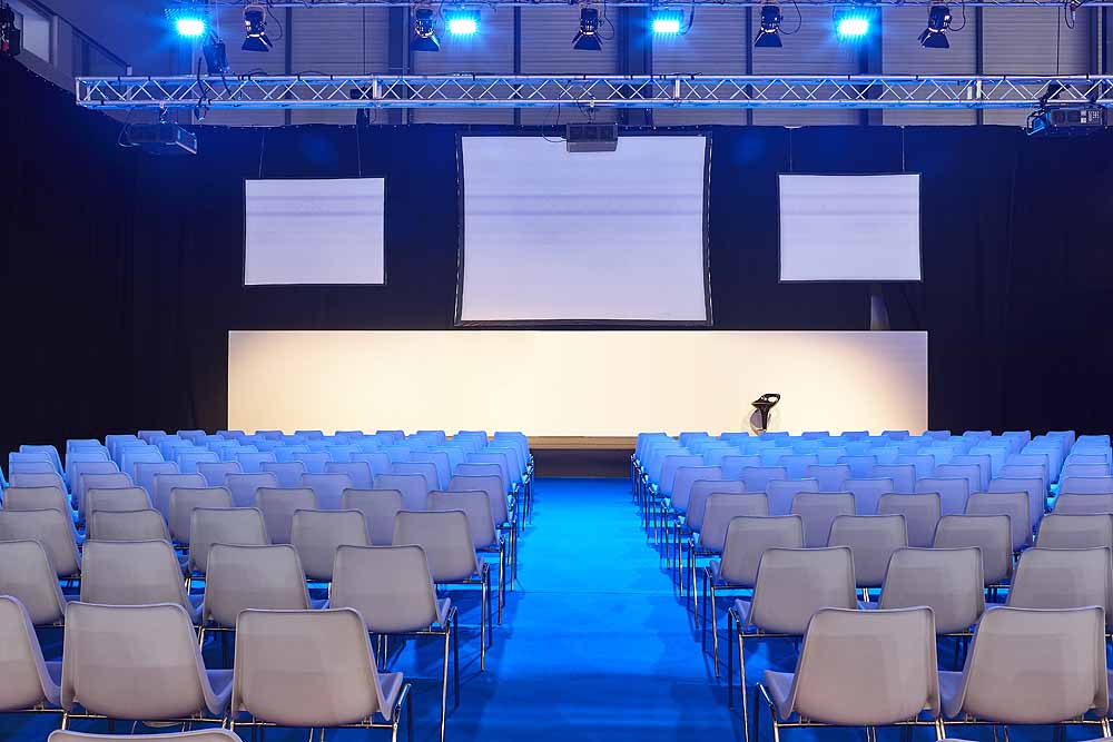 Conference room with video projectors, screens and platform. Professional presentation